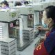 Worker of Vape factory testing the vape accessories